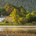 Tranquil house and lake scene in England's Lake District