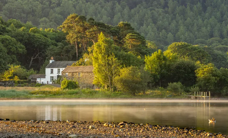 Tranquil house and lake scene in England's Lake District
