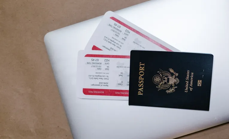 Close-up of a passport and boarding pass ready for international travel